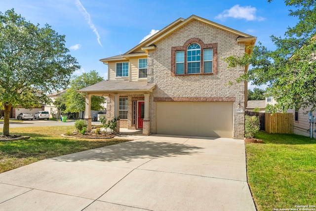 view of front facade featuring a garage and a front lawn