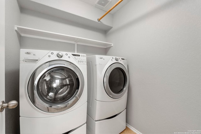 laundry room with independent washer and dryer