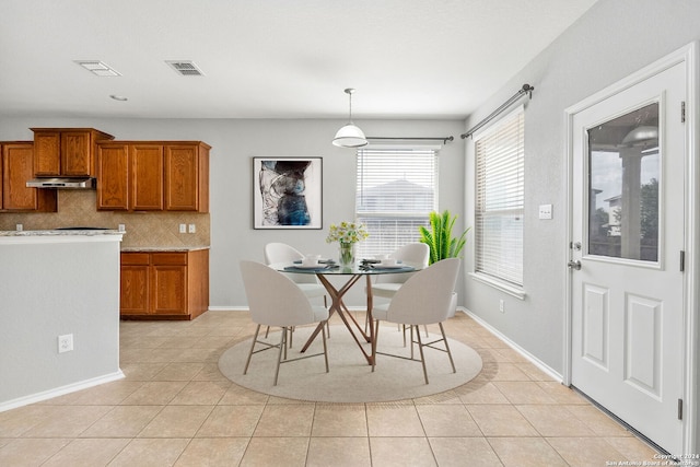 dining space with light tile patterned flooring