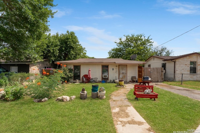 ranch-style home with a front lawn