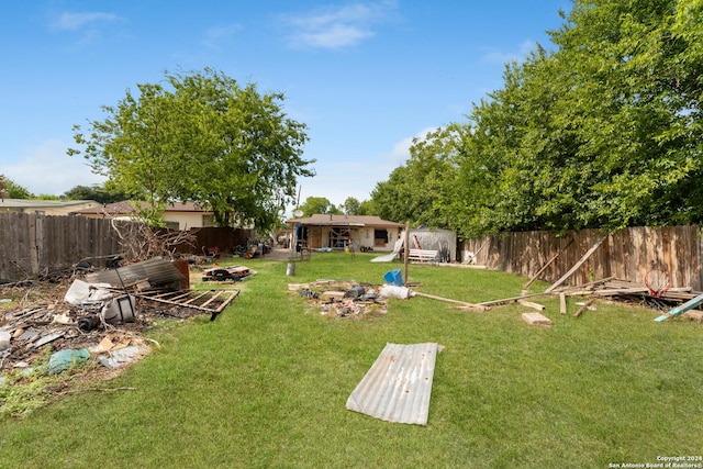 view of yard with a fire pit