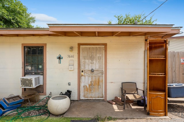 view of exterior entry featuring cooling unit