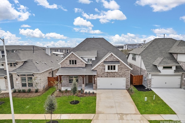 view of front of house with a front lawn and a garage