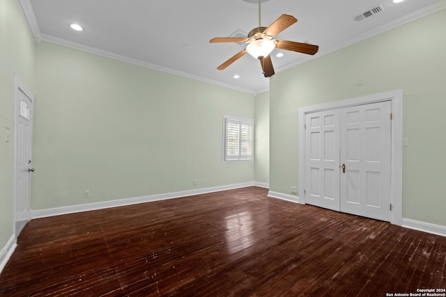 unfurnished bedroom with ceiling fan, crown molding, a closet, and hardwood / wood-style floors