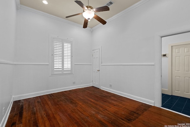 spare room with ceiling fan, crown molding, and dark hardwood / wood-style floors