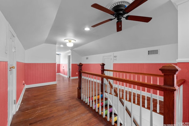 hall featuring lofted ceiling and dark hardwood / wood-style floors