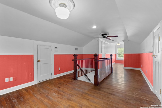 bonus room with ceiling fan, vaulted ceiling, and dark wood-type flooring