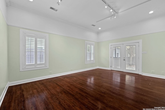 unfurnished room with ornamental molding, track lighting, french doors, and hardwood / wood-style flooring