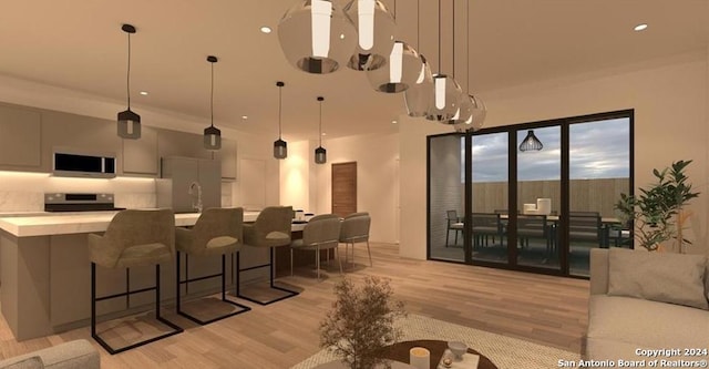 interior space with hanging light fixtures, gray cabinets, light hardwood / wood-style flooring, and stainless steel appliances