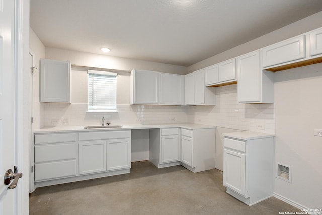 kitchen with sink and white cabinetry