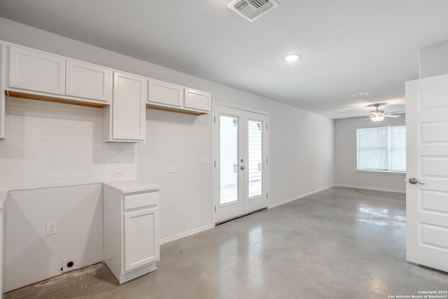 kitchen featuring french doors, ceiling fan, decorative backsplash, and white cabinets