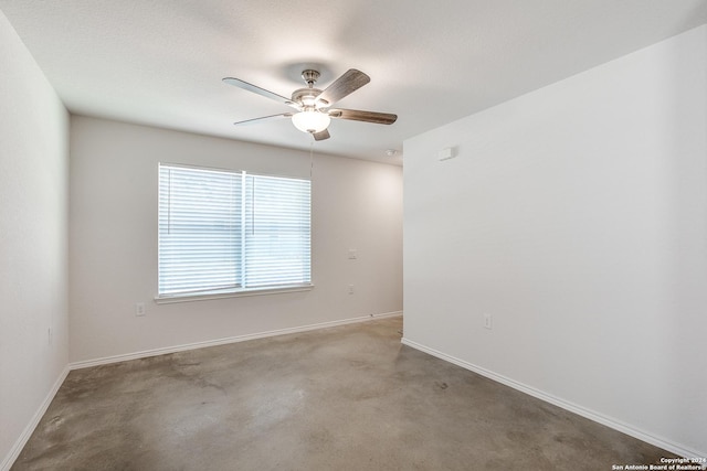 spare room with ceiling fan