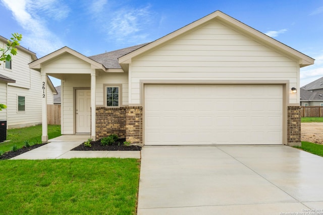 view of front facade featuring a garage, a front lawn, concrete driveway, and brick siding