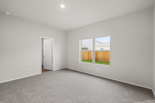 carpeted spare room with recessed lighting and baseboards