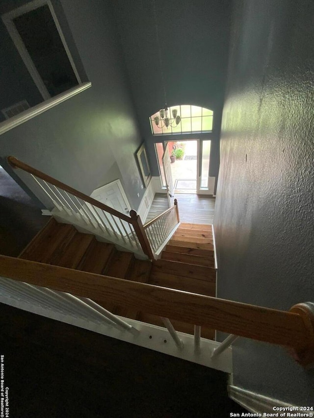 stairway featuring hardwood / wood-style flooring