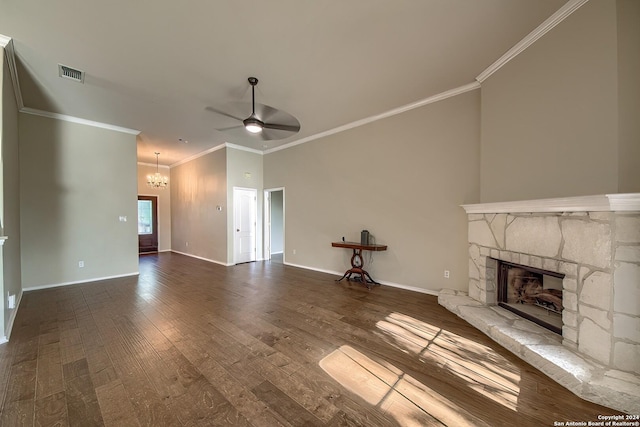 unfurnished living room with wood-type flooring, a fireplace, ceiling fan with notable chandelier, and ornamental molding