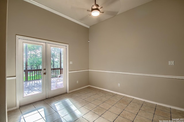 entryway with ceiling fan, light tile patterned floors, ornamental molding, and french doors