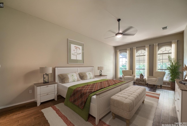 bedroom featuring ceiling fan and dark hardwood / wood-style flooring