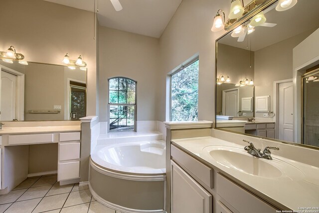 bathroom featuring vanity, a tub, and tile patterned floors