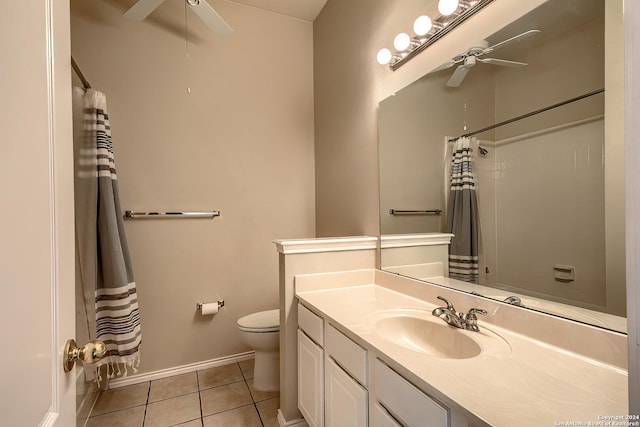 bathroom featuring toilet, tile patterned flooring, vanity, and curtained shower