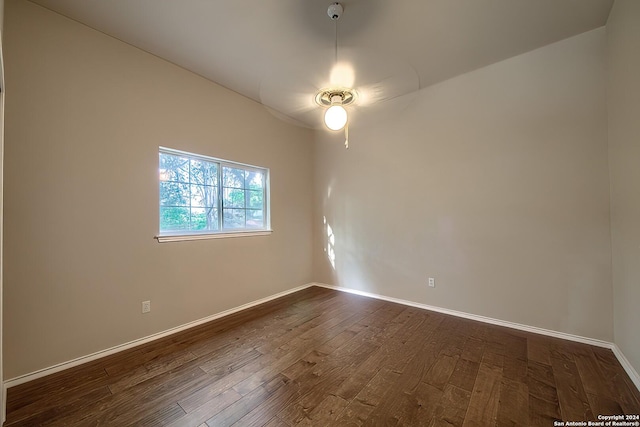 unfurnished room featuring dark wood-type flooring