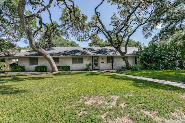 ranch-style home with a front lawn