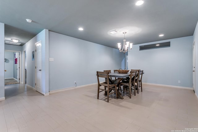 dining area with an inviting chandelier