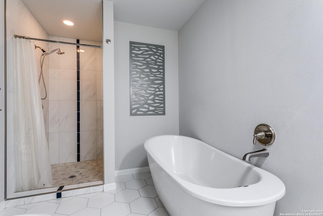 bathroom featuring tile patterned floors and plus walk in shower