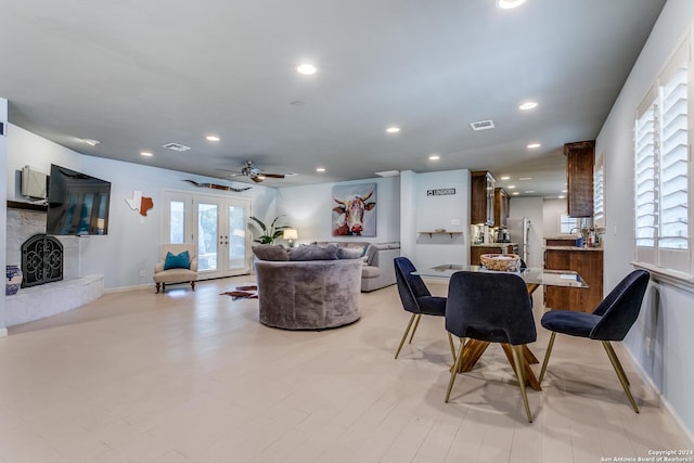 interior space with ceiling fan and french doors