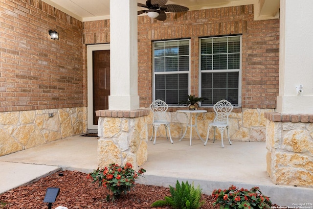 view of exterior entry featuring ceiling fan