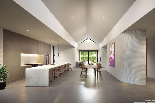 dining area featuring concrete flooring and high vaulted ceiling