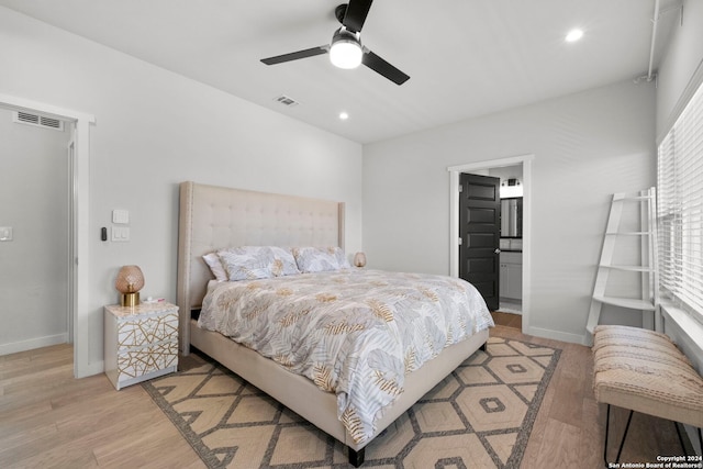 bedroom with ceiling fan, light hardwood / wood-style floors, and ensuite bathroom