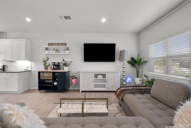 living room with light hardwood / wood-style flooring