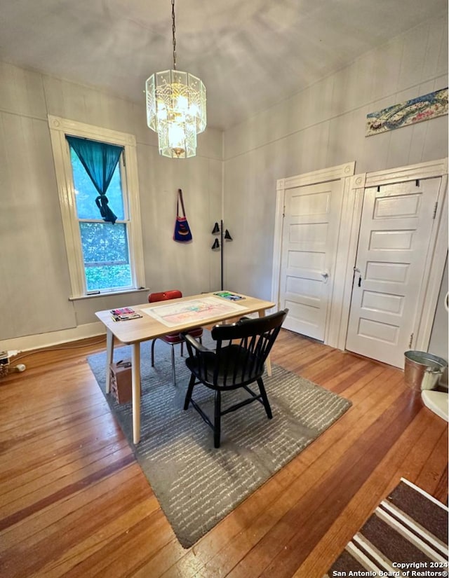 218 Coleman, San Antonio, TX 78208 - dining room with hardwood / wood-style floors and a chandelier