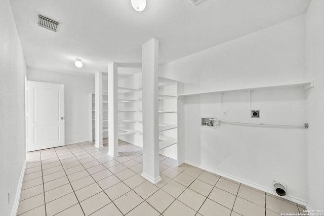 laundry area featuring light tile patterned flooring, hookup for a washing machine, hookup for an electric dryer, laundry area, and visible vents