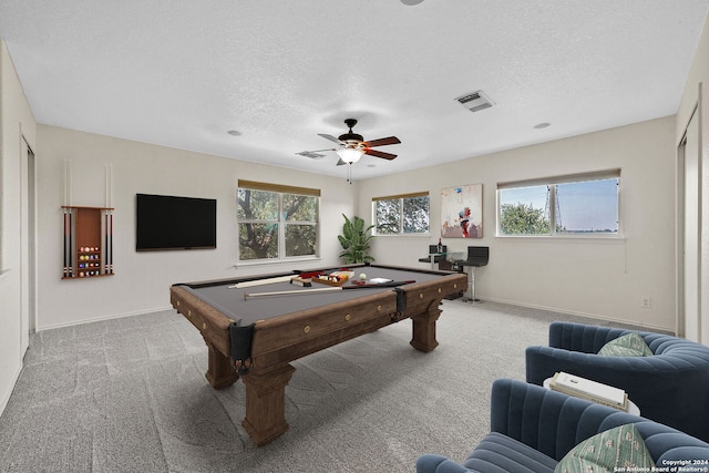 recreation room with a textured ceiling, light colored carpet, pool table, visible vents, and baseboards