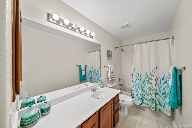 full bath featuring visible vents, shower / bathtub combination with curtain, toilet, vanity, and a textured ceiling