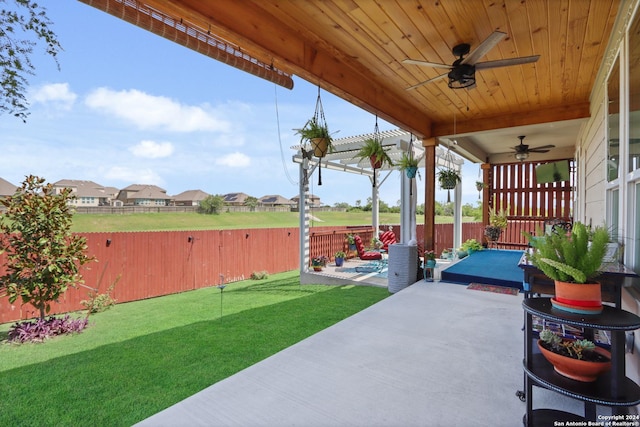 view of patio / terrace featuring ceiling fan and a pergola