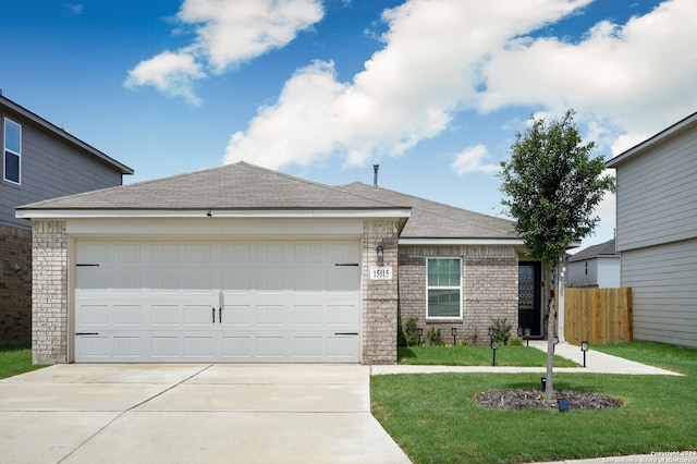 ranch-style home featuring a garage and a front lawn