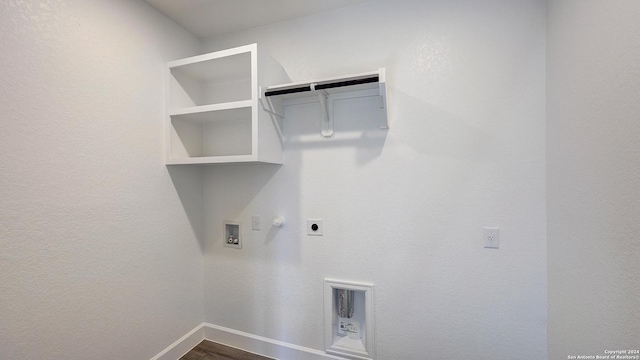 washroom with gas dryer hookup, hookup for a washing machine, electric dryer hookup, and wood-type flooring