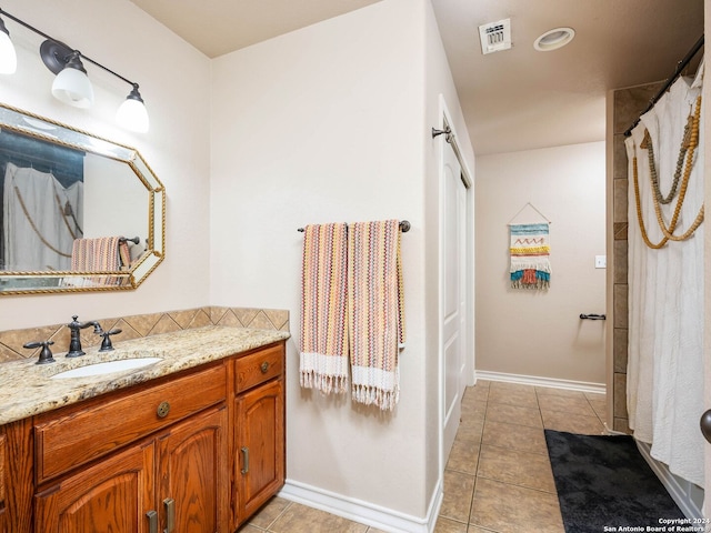 bathroom with vanity and tile patterned flooring