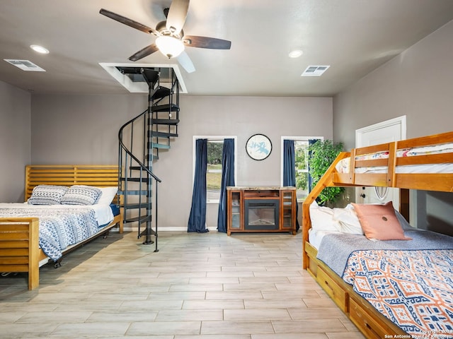 bedroom featuring ceiling fan and hardwood / wood-style floors