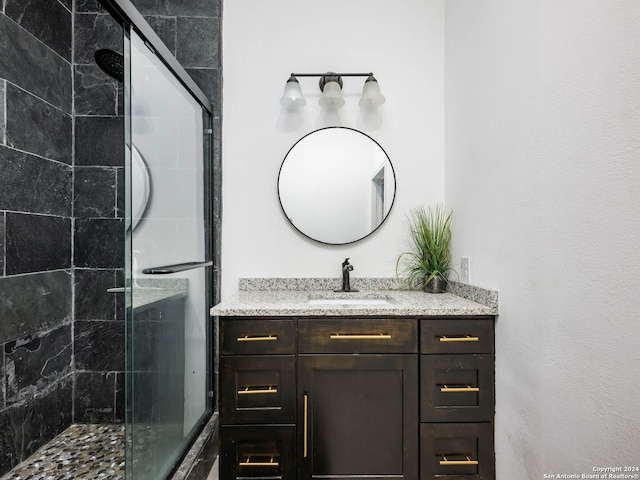 bathroom with vanity and walk in shower