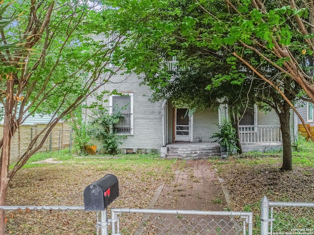 617 Dawson St, San Antonio, TX 78202 - view of property hidden behind natural elements featuring a porch and a fenced front yard