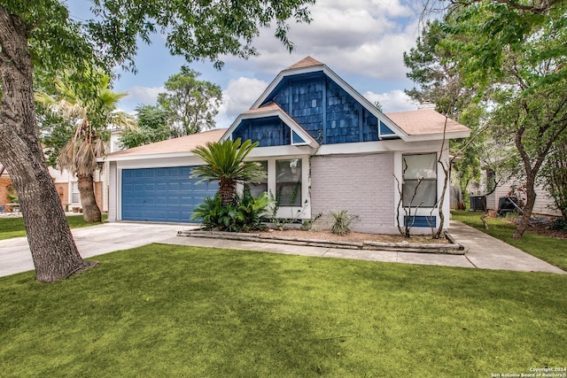 view of front of home with a garage and a front yard