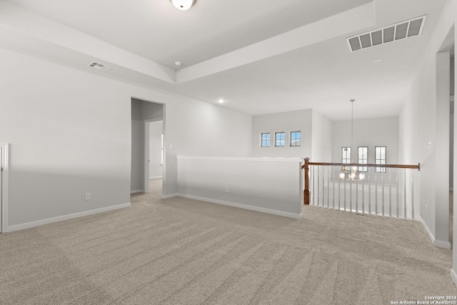 unfurnished room with light colored carpet