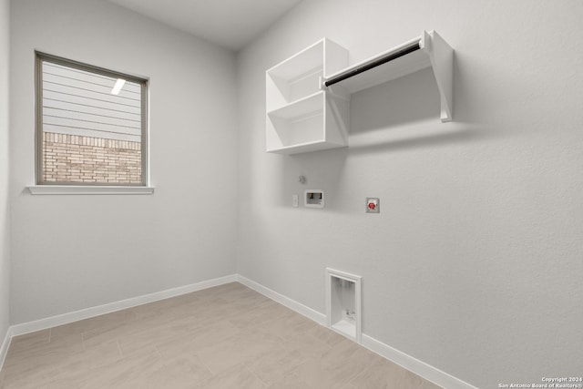 laundry area with hookup for a washing machine, hookup for an electric dryer, and gas dryer hookup