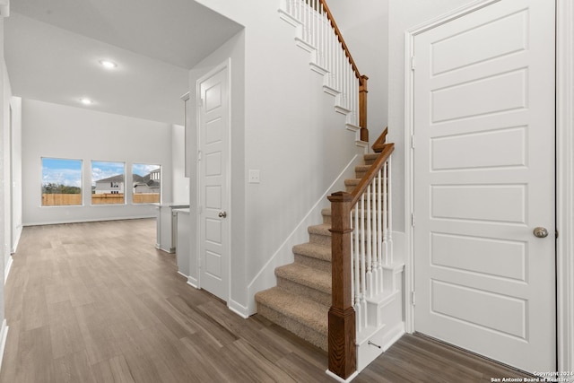 stairs with wood-type flooring