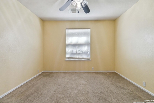 spare room with ceiling fan and carpet floors