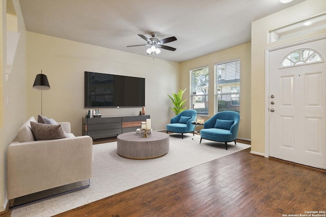 living room with ceiling fan and wood-type flooring